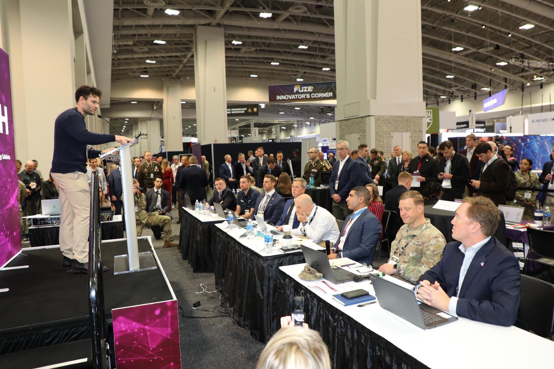 Founder pitching at AUSA Innovator's Corner